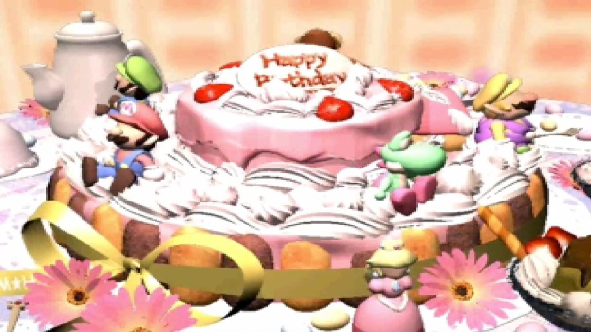 A pink cake reading 'Happy Birthday', with charicatures of Mario, Yoshi, and Peach sitting on the cake.